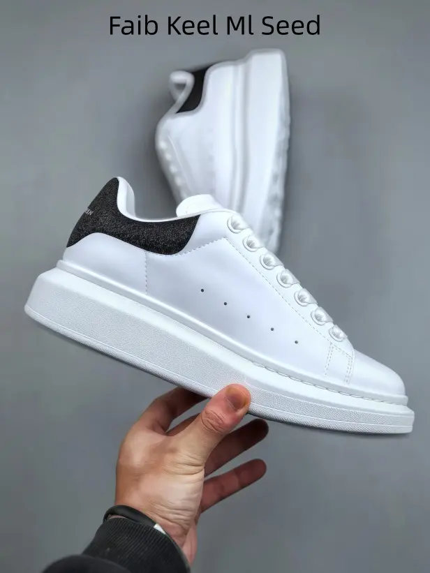 Minimalist low-top white trainers with textured black glitter heel panel, cushioned lift sole, comfy unisex footwear for shopping travel casual daily outfits