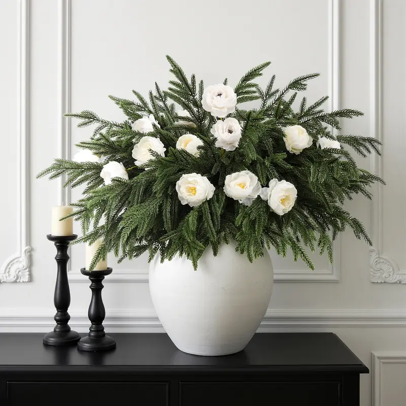 Artificial Norfolk pine greenery styled with white flowers