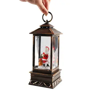 Lighted Musical Christmas Snow Globe Lantern. Vintage holiday water globe with swirling glitter and warm glowing light. Create an aesthetic festive home decor and cozy Christmas vibe.