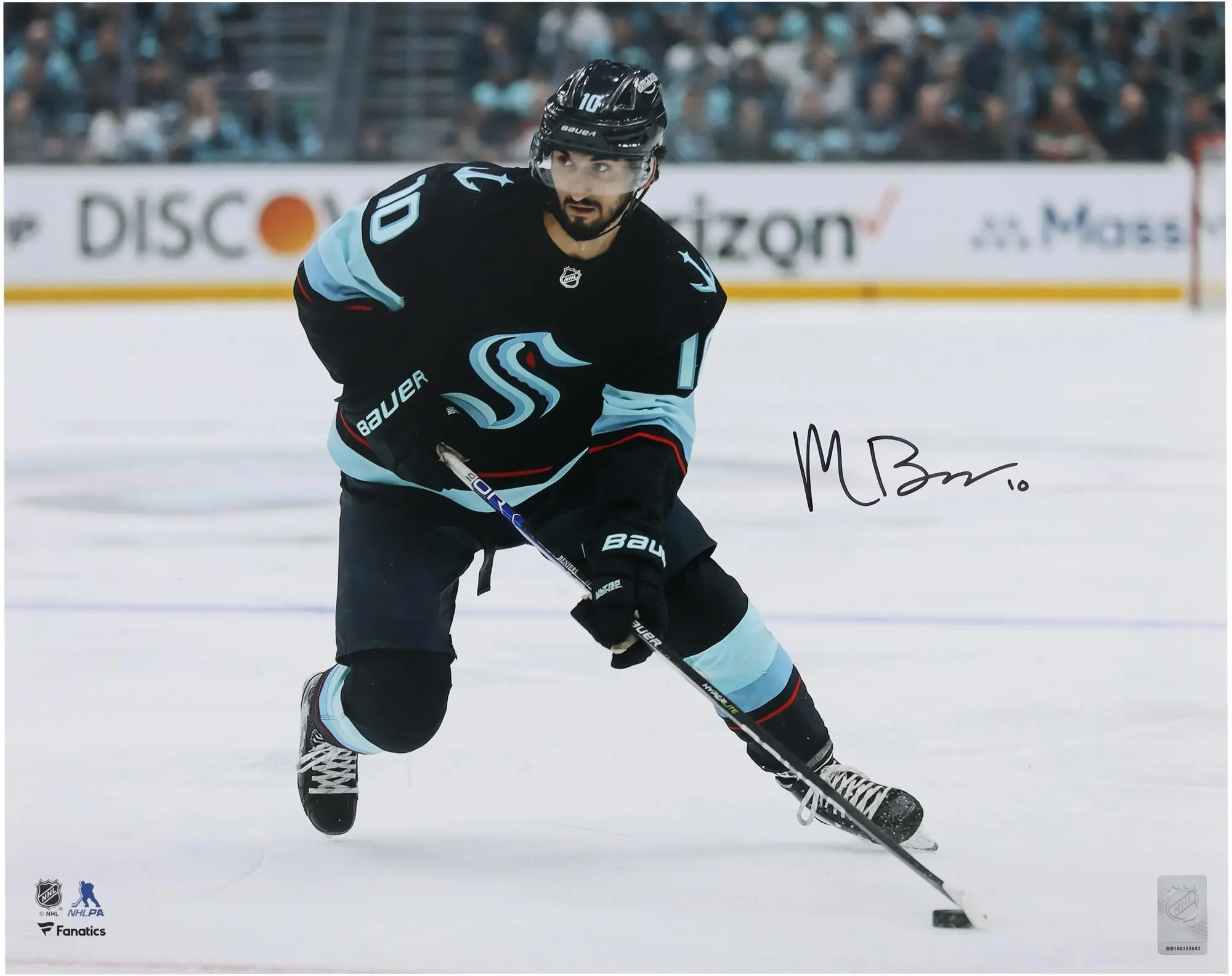 Matty Beniers Seattle Kraken Autographed 16" x 20" Navy Jersey with Puck Photograph - Fanatics Authentic Certified