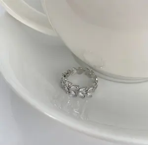 Alloy & Synthetic Zircon Ring — Spring Refresh: Light Luxury, High-End Design featuring Wheat-Ear and Interlocking Ring Motifs