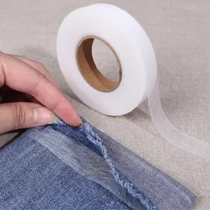 One durable double-sided adhesive fabric tape, 0.8 inches wide and 213 feet long. It is a sticky tape tool suitable for sewing edges of homemade decorative fabrics.