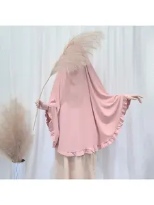 Ruffled and scalloped cape-style headscarf with loose and flowing drape, comfortable and simple for women