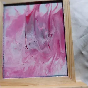 wood framed pink painting