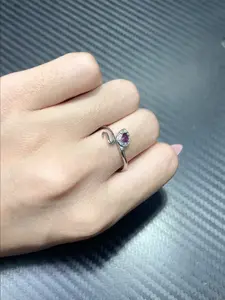 Candice(8886)gc.A delicate snake ring, its silver coils cradling a luminous amethyst gem