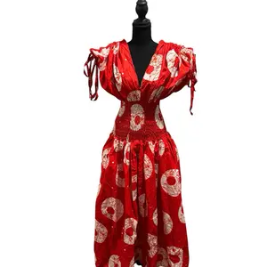 Vibrant Red and White Smokey Ankara-style Dress with Bold Circular Print Smocked Waist Puffed Sleeves Adjustable Tie Free Size Casual Womenswear