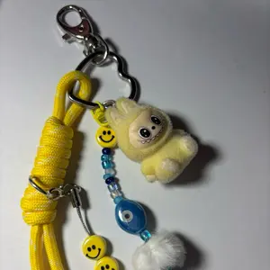 Blue Skies Smile Keychain with Yellow Plush Bear Charm and Evil Eye Bead for Accessory Enthusiasts