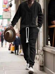 A men's casual trousers V-neck versatile jacquard knitted sweater set, comfortable fabric, slim-fit men's two-piece outfit matching men's clothing, slim-fit suit, formal wear.