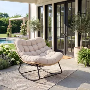 Reinforced Rocking Patio Chair with Soft Fleece Crafted from weather-resistant rattan, paired with solid rubber wood and a heavy-duty steel frame for outstanding stability. Features a UV-proof cushion, cozy fleece surface and a handy side pocket. Supports