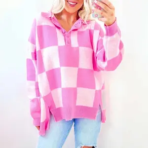 Pink checkerboard half-button collared drop-shoulder sweater that can be worn with a raincoat