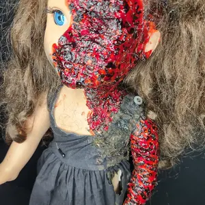 Creepy horror doll Singed Sandra
