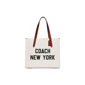 COACH Men's Large Pebble-Textured Leather and Coated Canvas Shoulder Bag with Magnetic Closure in White