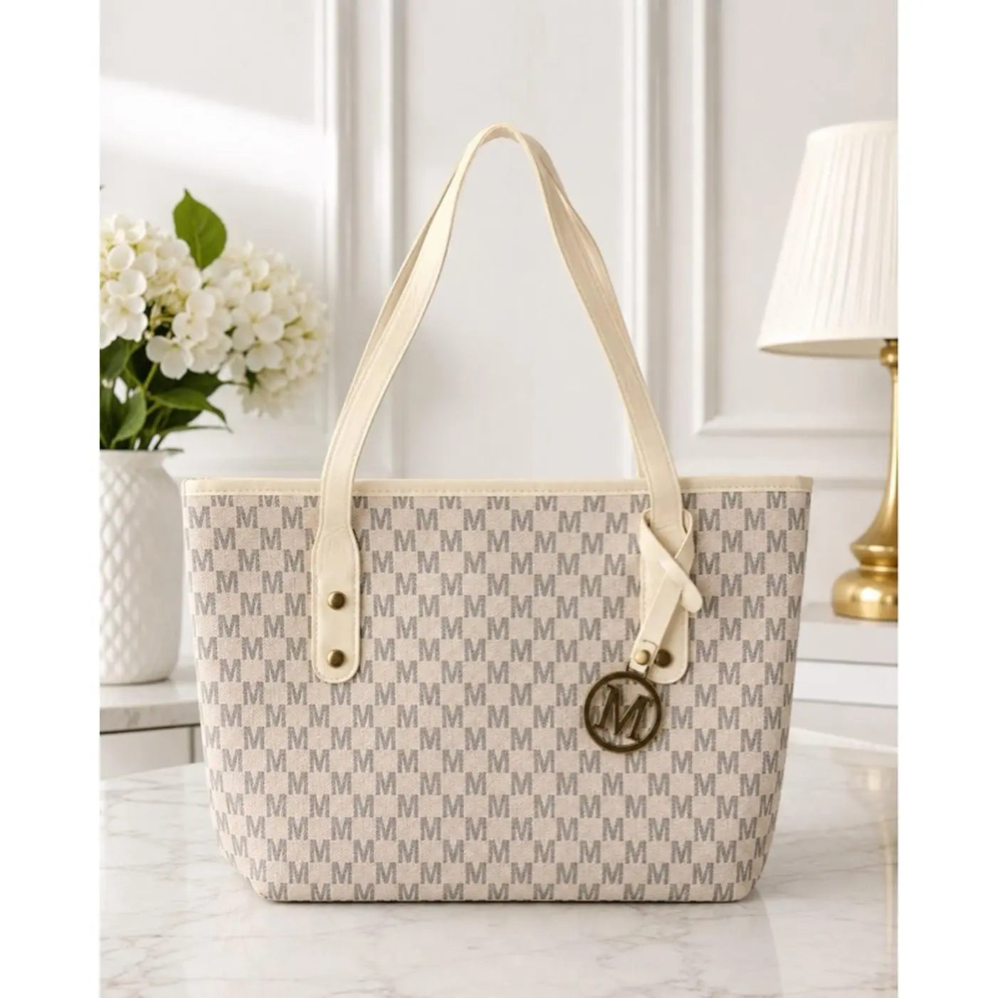 Elegant Tote Bag with Monogram Pattern and Gold Tone Logo Charm