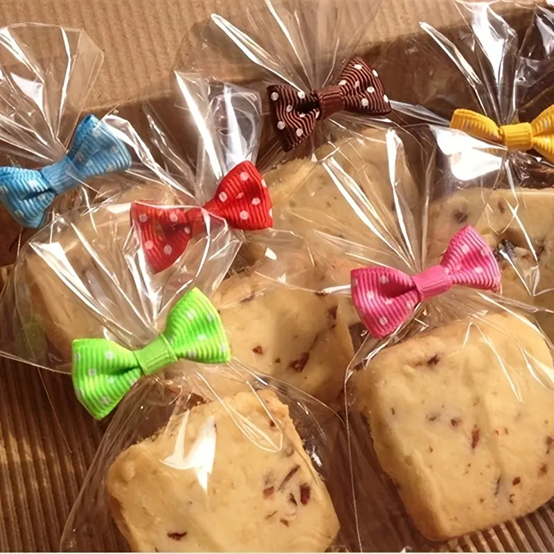 200pcs/set，100pcs Luxurious Golden Bowknot Ties+100pcs Transparent Clear Cellophane Treat Bags (Chic Gift Bag Decorations, Gift Wrapping Supplies for Festive Occasions, Secure Candy & Biscuit Packaging, Perfect for Halloween, Thanksgiving, Christmas)