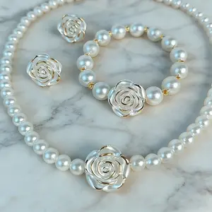 4-piece French-style elegant imitation pearl jewelry set, featuring a delicate white floral design on the collarbone necklace, bracelet, and stud earrings.This set is a sophisticated and versatile choice for everyday wear, parties, banquets, and weddings