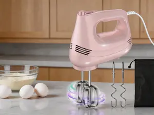 Handheld Electric Mixer equipped with stainless steel whisk, dough hook attachments and a storage bag. Features 5 adjustable speeds and turbo mode, ideal for whipping eggs, cream and mixing cake batter for baking. Pink finish