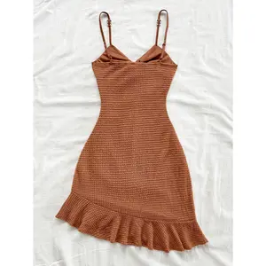 A pure and sexy halter dress that is tight and slimming, with ruffled edges and a hip-hugging short dress for women