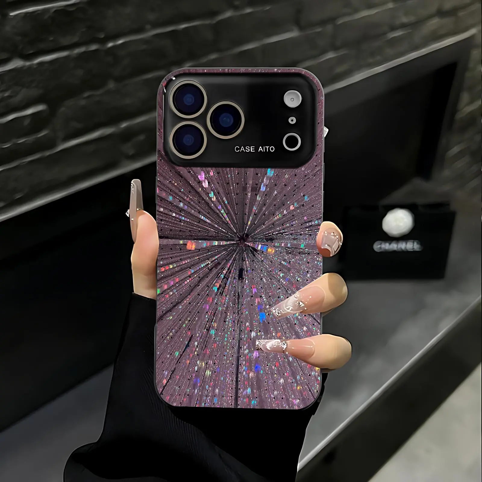 Radial rhinestone starlight print phone case. Compatible with iPhone 17 Pro Max, 16 Pro Max, 15 Pro Max, and 14 Pro Max. Full lens protection. Also compatible with iPhone 15, 14, 13, and 12. Made of skin-friendly TPU material.