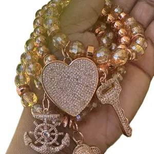 Beaded Charm Bracelet Stack in Rose Gold Featuring Golden Beads