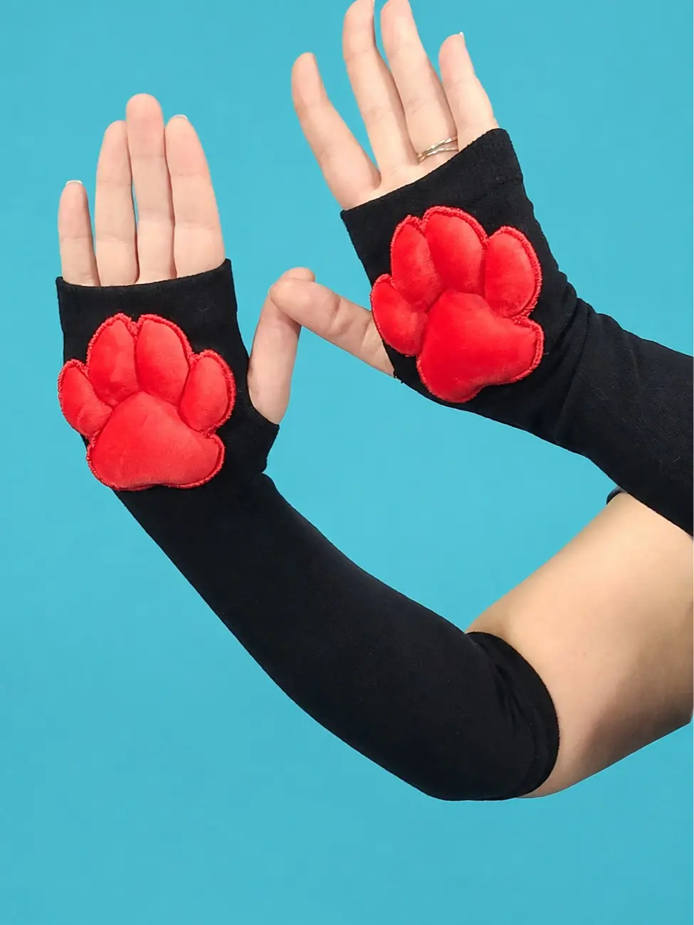 Red Mochi Stuffed Paw Pad on Black Gloves
