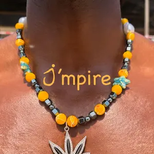 "NOVA"  Metallic and Orange Beaded Necklace with Silver Leaf Pendant, Star Beads & White Pearl Accents | Nova Necklace | Statement Jewelry