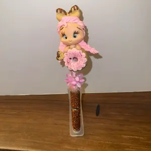 Cute Doughnut Fancy Pen with Adorable Doll Topper and Sparkling Gold Barrel Perfect for Kids and Collectors