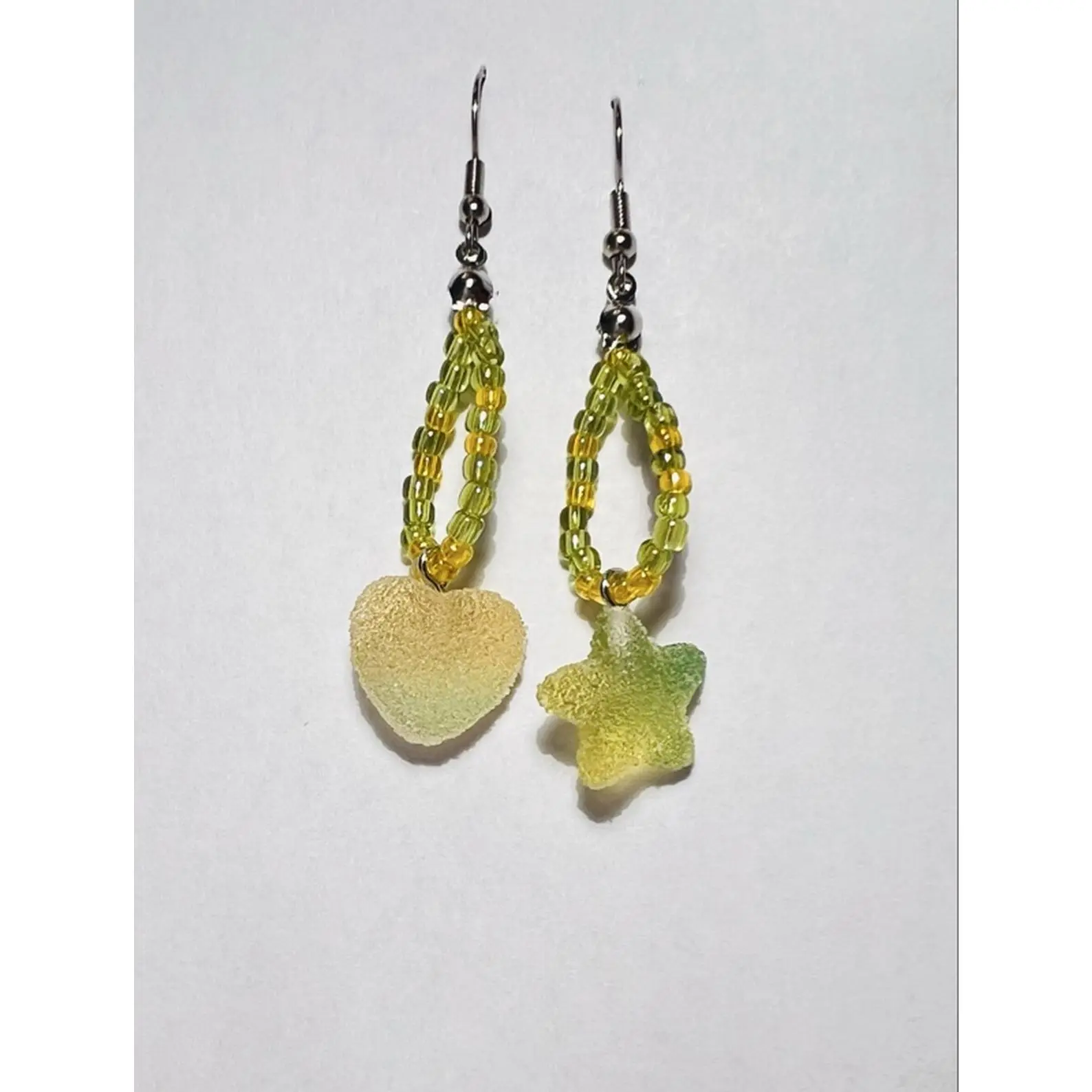 Green Sour Apple Club Mismatched Drops Earrings with Heart and Star Charms Vibrant Lime and Lemon Seed Bead Hoops Textured Faux Sugar Coated Gummy Charms Unique Fun Statement Piece
