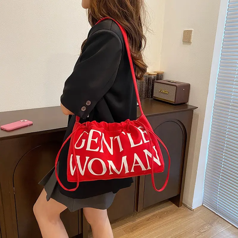 New Arrival: Trendy, versatile, letter-accented "dumpling bag"—a stylish, minimalist, soft-structured shoulder bag with a spacious interior, perfect for summer.