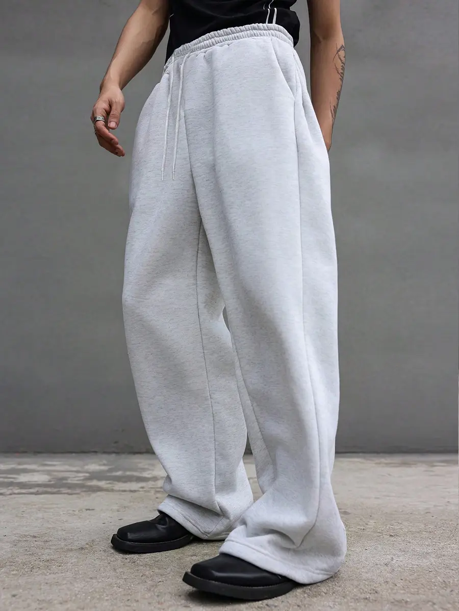 Men’s drawstring wide-leg sweatpants, loose straight-leg casual pants, American street-style long pants, trendy youth long pants, everyday wear pants, basic men’s pants, wide-leg silhouette pants with a fluid drape, minimalist casual bottoms, boys’ everyd