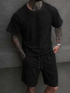 Men’s two-piece summer set featuring a ripped T-shirt and shorts—casual, loose street-style athletic outfit. Men’s retro distressed design short set with a crew-neck T-shirt and shorts; breathable and comfortable clothing, perfect for summer casual wear a