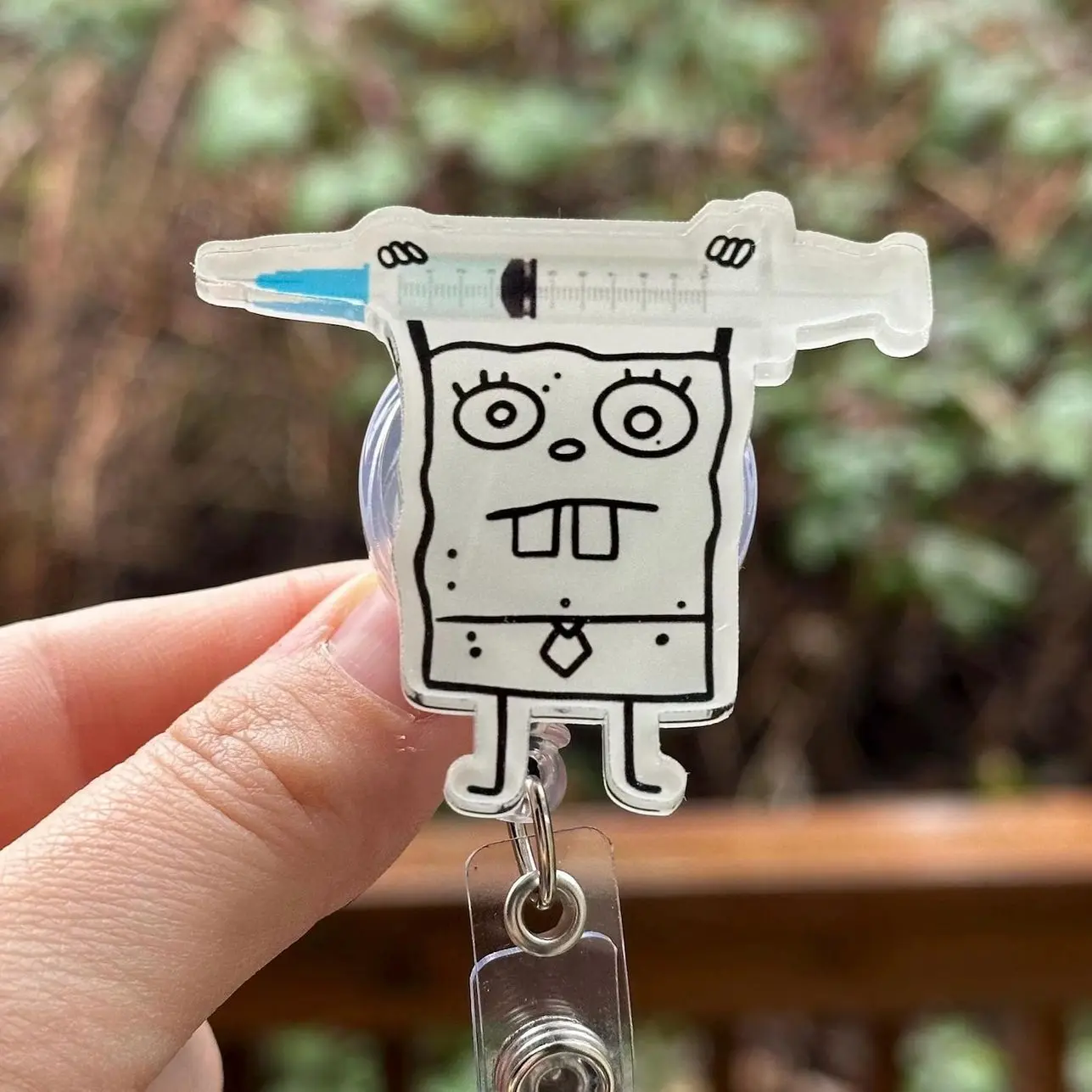 Cartoon Doodle with Syringe Badge Reel