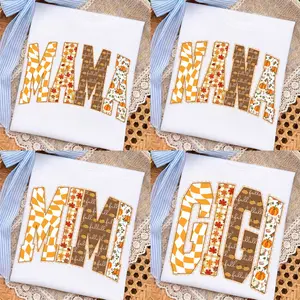 Comfort Colors Fall Mama Nana Mimi Gigi T-Shirt - Retro Patchwork Letters With Orange Checkerboard, Maple Leaves, Pumpkins And Autumn Floral Prints, Thanksgiving Tee For Women, Pumpkin Patch Outfit, Cozy Harvest Gift For Moms, Grandmas And Loved Ones