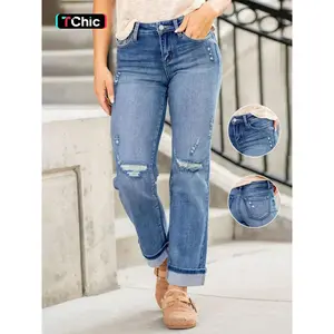 Women's elastic button front torn jeans with rolled up cuffs, fashionable all year round