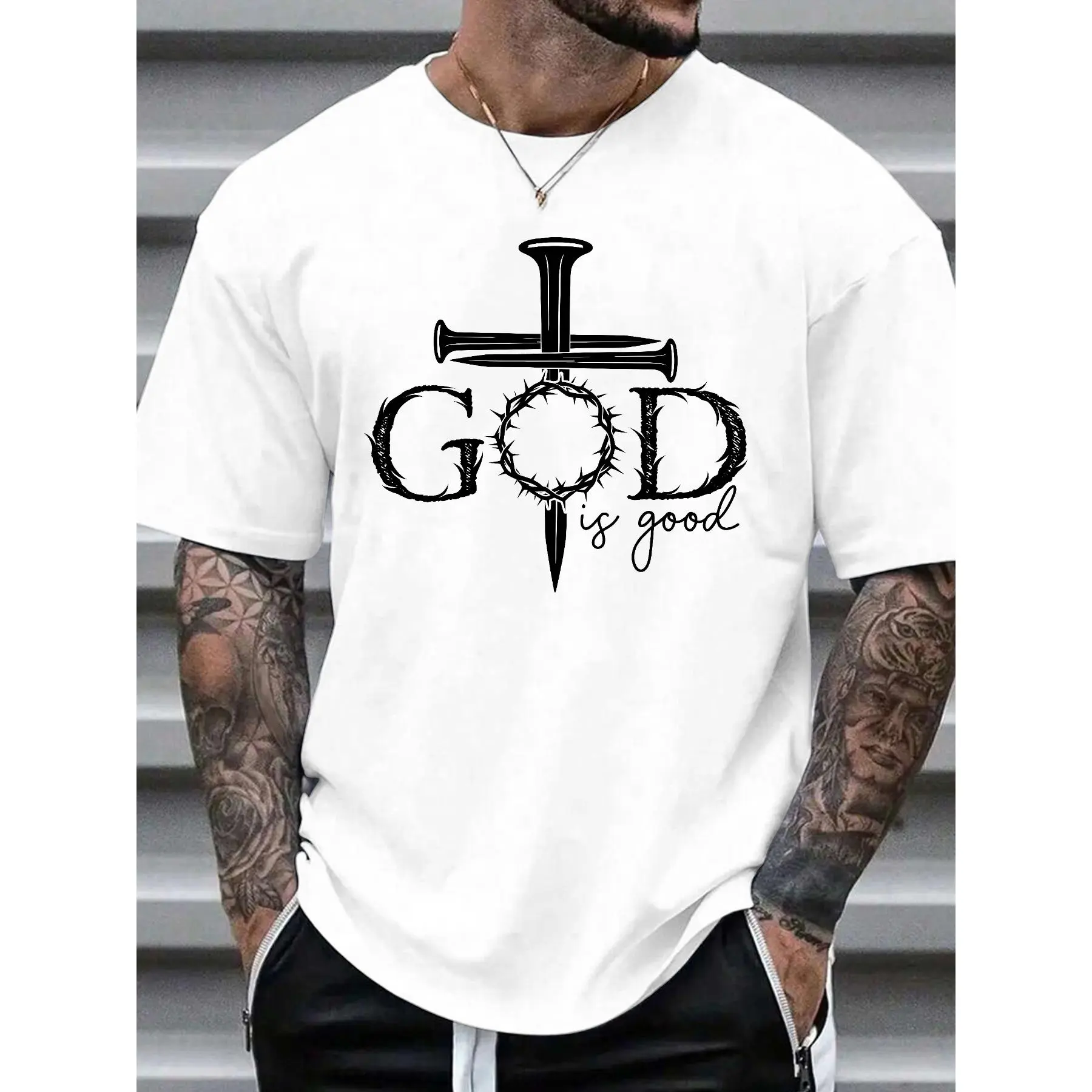 "Men's T - Shirt with a Profound Religious Message: 'GOD is good' Embellished with Cross and Crown of Thorns Motifs, Exuding Spiritual Reverence"