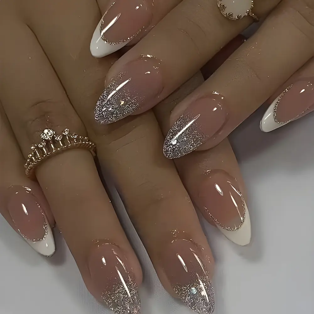 Chic, minimalist glitter press-on nails with a sophisticated vibe, featuring a white-tip French design and teardrop-shaped tips