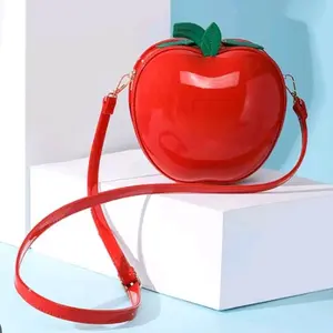 Apple-Shaped Crossbody Bag for Women - Red Glossy Finish with Green Leaf Detail and Adjustable Strap
