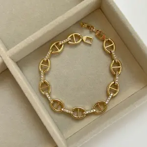 Elegant Gold Tone Bracelet with Rhinestone Accents and Interlocking Links for Women