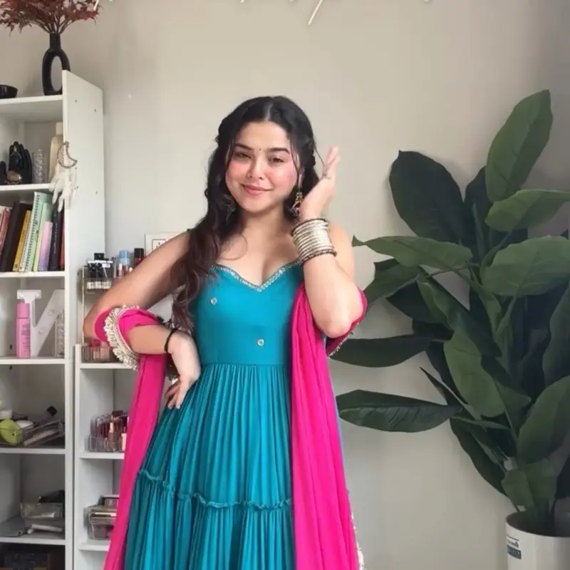 Beautiful Teal Anarkali Set with Dupatta   This stunning three-piece ethnic set features a flowy teal Anarkali gown designed with soft, layered gathers for an elegant and comfortable fit. The neckline is beautifully highlighted with delicate pearl and go