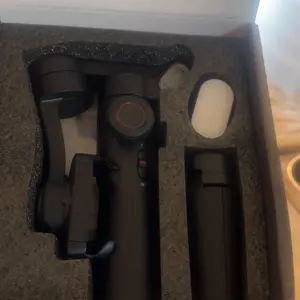 Product Review of Handheld 3 Axis Anti-shake Shooting Stand (1 Count), Rotating Automatic Face Tracking Tripod Stabilizer for Live Video, Phone Accessories, Content Creator Tools from A**l ** **