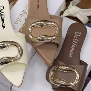 Dewoman Chic pointed-toe slip-on mules with a bold gold buckle detail