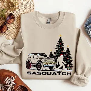 Ford Bronco Lover Christmas Unisex Sweatshirt, With Sasquatch Christmas Trees Candy Cane Xmas Lights And Bronco Truck Sweatshirt Or Tshirt, Unisex Sweater Pullover Tee