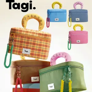 Tagi Bag Storage High-end Portable Waterproof Makeup Bag Niche Design High Appearance Handheld Travel Storage Bag