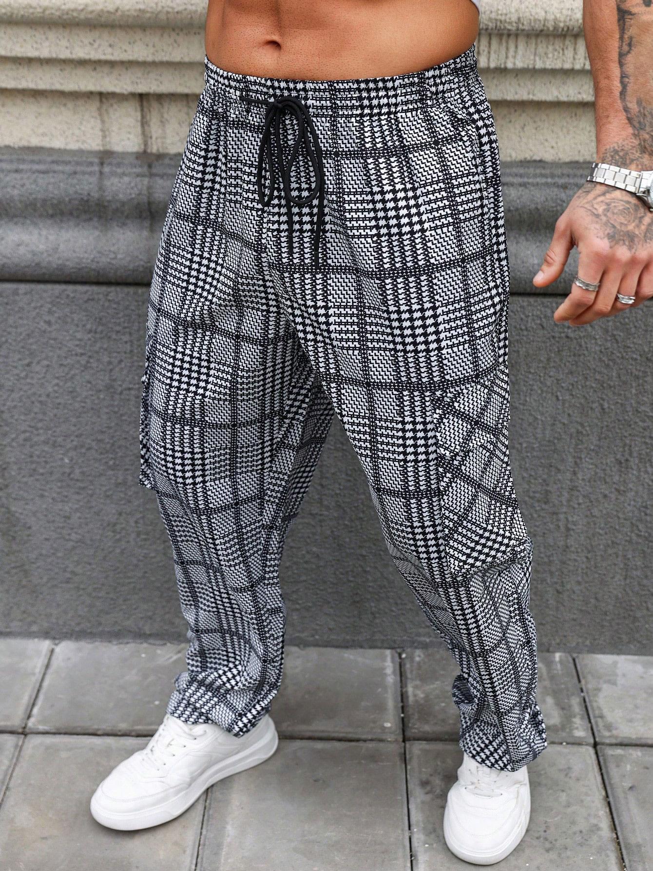 Men’s black and white houndstooth wide straight-leg pants with an elastic drawstring waist and side pockets; lightweight, breathable, loose fit; casual street style for everyday wear, vacations, and home.
