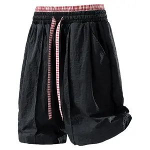 Summer color-block patchwork shorts with drawstring elastic waistband and pockets; men’s outdoor casual quick-dry breathable solid-color loose athletic shorts; American retro streetwear brand; suitable for everyday wear and vacations.