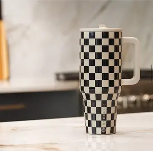 The Hydrojug grid pattern features a classic black and white grid design. This is an original travel-sized 40-ounce double-layer stainless steel flip-top stainless steel water bottle with a leak-proof design and rubber base.
