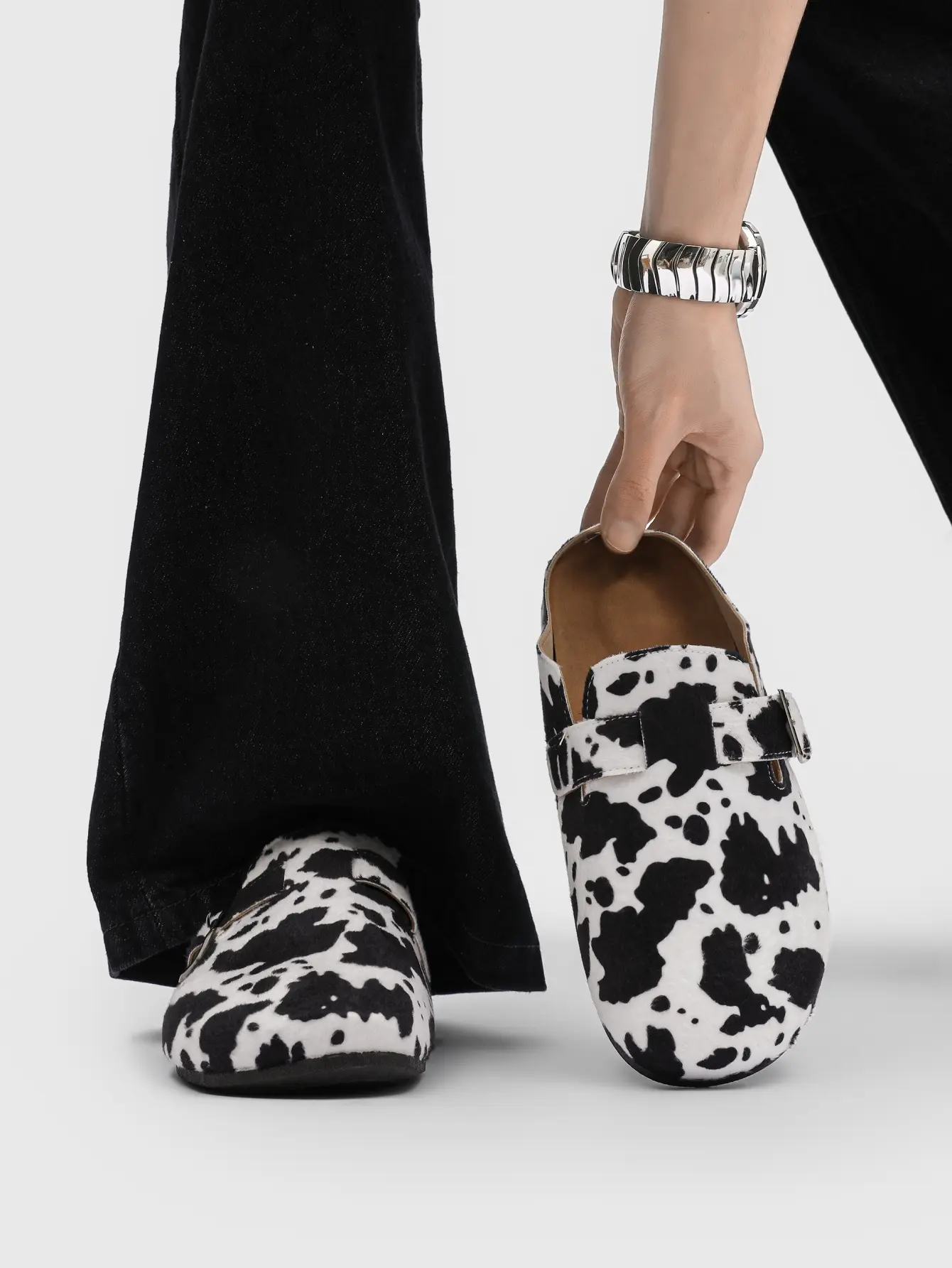 Unique cow print shoes — retro faux fur mules with an adjustable buckle and soft sole