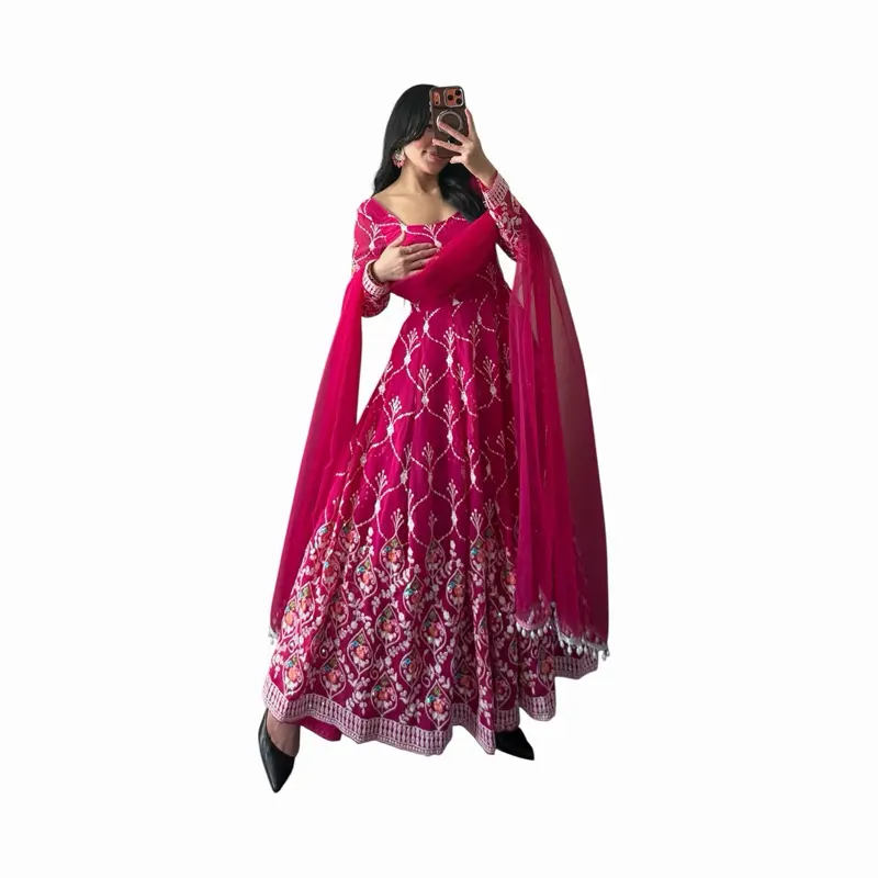 Reddish pink Anarkali suit with a graceful flare and elegant detailing. Perfect for weddings and festive occasions. Soft, flowy, and beautifully flattering.