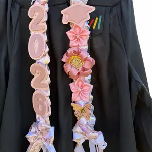 Gorgeous pink graduation lei  Decorated with ribbon flowers