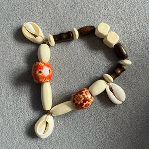 Protection Bracelet with Cowrie Shells and Wooden Beads- SOULAANI inspired