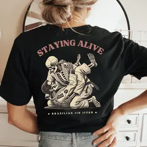 Staying Alive" Brazilian Jiu Jitsu T-Shirt Skeleton BJJ Graphic Tee Funny Jiu Jitsu Gift for Men WomenFunny Skeleton Brazilian Jiu Jitsu T-Shirt "Staying Alive" BJJ Grappling Graphic Tee Jiu Jitsu Gift for BJJ Practitioners